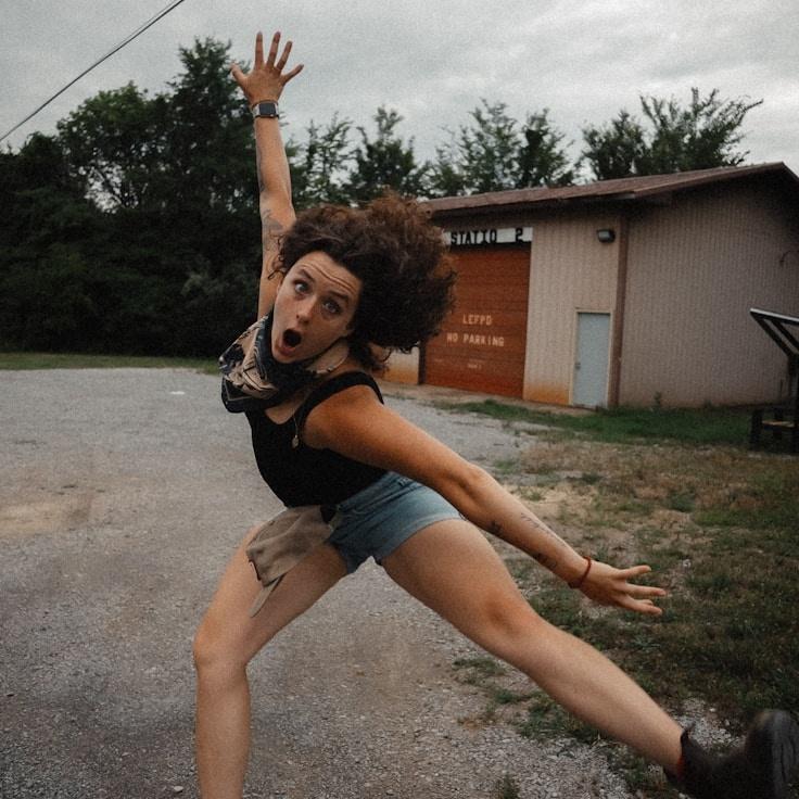 Aditi Sharma, Lead Design Curator at SeaLedgerPebble, reviewing corporate floral arrangements